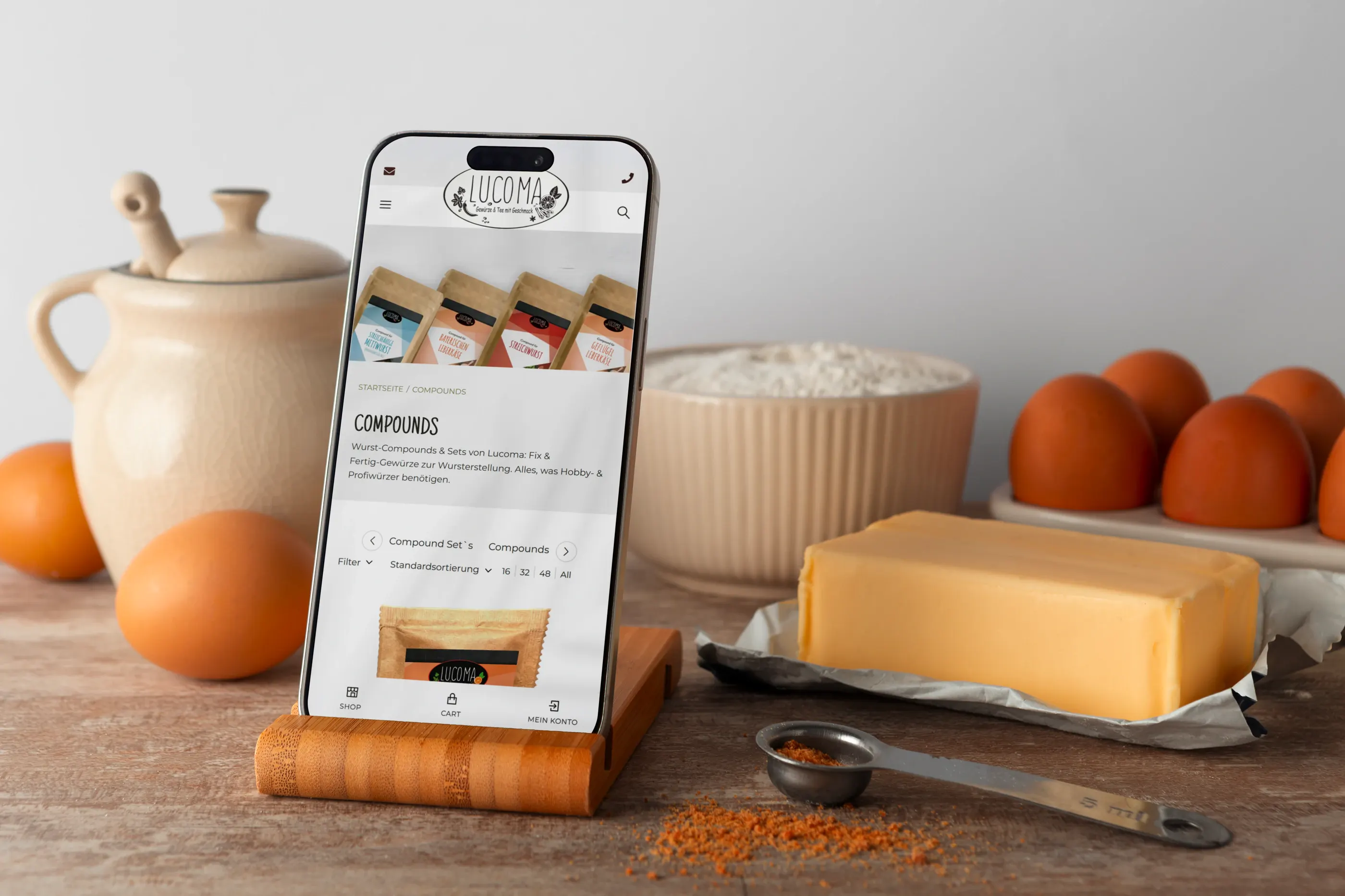 Smartphone mit der Kategorie Compounds in einer Küche mit Eiern und Butter